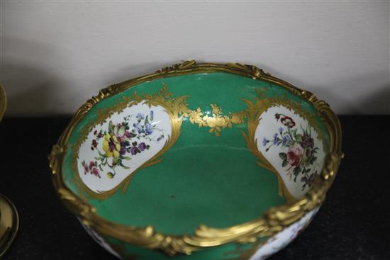 A pair of Sevres porcelain green ground bowls, c.1773, diameter incl. mounts 24cm (9.5in.), some decoration possibly later